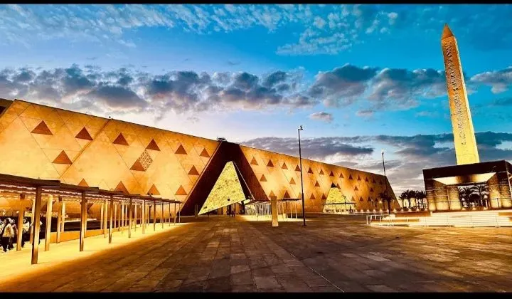 Grand Egyptian Museum's main hall with colossal statues of ancient pharaohs