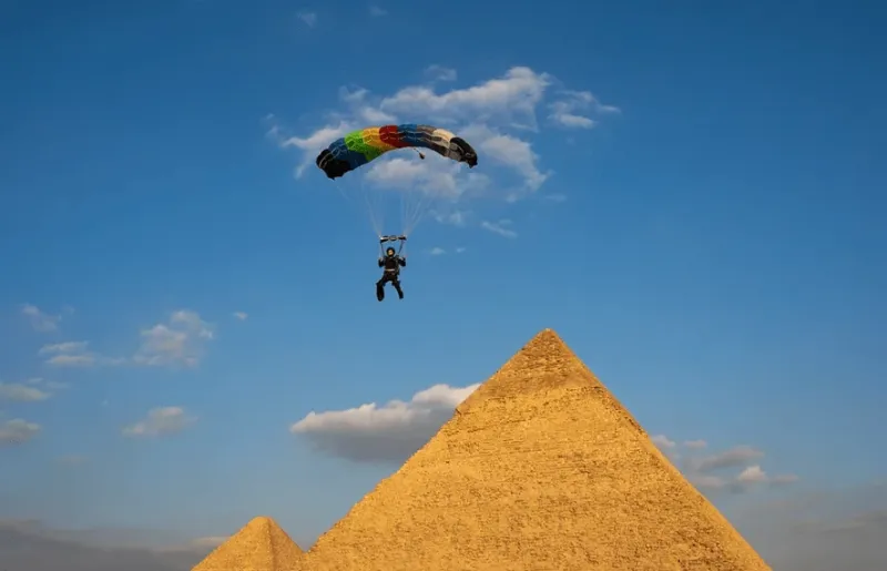Skydiver flying above the Pyramids of Giza in Egypt